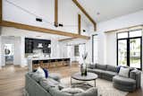 The warm wood of flooring and beams speaks to the historical color palette of the farmhouse.  