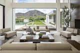The great room provides stunning views of iconic Camelback Mountain while the cooking and entertaining are underway. A neutral and subdued color palette makes nature the art on the wall. 