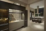A reach-through bar provides beauty, convenience, and delineation of spaces. 