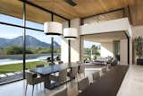 Million-dollar views of Camelback Mountain turn the kitchen and adjacent patio into favorite nesting spots. A custom table by Peter Thomas Designs is illuminated by double pendants from Hinkley Lighting hanging from a ceiling of Douglas fir.

Project Details // Now and Zen
Renovation, Paradise Valley, Arizona
Architecture: Drewett Works
Builder: Brimley Development
Interior Designer: Ownby Design
Photographer: Dino Tonn
Limestone (Demitasse) flooring and walls: Solstice Stone
Windows (Arcadia): Elevation Window & Door
Table: Peter Thomas Designs
Pendants: Hinkley Lighting

https://www.drewettworks.com/now-and-zen/