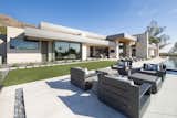 Broad expanses of zinc fascia and glass define this contemporary estate, creating a rhythm of solid and void. Inset in the limestone paving is a stone-filled fire pit. The outdoor furniture is from Restoration Hardware.

Project Details // Now and Zen
Renovation, Paradise Valley, Arizona
Architecture: Drewett Works
Builder: Brimley Development
Interior Designer: Ownby Design
Photographer: Dino Tonn
Exterior limestone: Solstice Stone
Windows (Arcadia): Elevation Window & Door

https://www.drewettworks.com/now-and-zen/