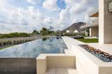 Mirroring the billowing clouds above, the water's surface is like a compositional piece of art. Nearby, a linear fire feature aligns with a limestone walkway.
 
Project Details // Now and Zen
Renovation, Paradise Valley, Arizona
Architecture: Drewett Works
Builder: Brimley Development
Interior Designer: Ownby Design
Photographer: Dino Tonn
Exterior limestone: Solstice Stone

https://www.drewettworks.com/now-and-zen/