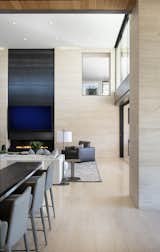 Just above the family room, an interior window provides a peek into the upstairs media den. Limestone floors and walls create a continuous flow throughout much of the house. Blackened steel panels highlight the fireplace wall.

Project Details // Now and Zen
Renovation, Paradise Valley, Arizona
Architecture: Drewett Works
Builder: Brimley Development
Interior Designer: Ownby Design
Photographer: Dino Tonn
Limestone (Demitasse) flooring and walls: Solstice Stone
Windows (Arcadia): Elevation Window & Door

https://www.drewettworks.com/now-and-zen/