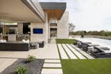 C.P. Drewett incorporated towering limestone-clad panels that project away from the house, cocooning the outdoor spaces. At the same time, walls of glass that pocket open make the line between inside and out almost imperceptible.

Project Details // Now and Zen
Renovation, Paradise Valley, Arizona
Architecture: Drewett Works
Builder: Brimley Development
Interior Designer: Ownby Design
Photographer: Dino Tonn
Indoor/outdoor limestone: Solstice Stone
Windows (Arcadia): Elevation Window & Door

https://www.drewettworks.com/now-and-zen/