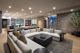 This multi-functional entertaining space with its optional glassed-in car showroom serves as a great family getaway below ground. Adding to the subterranean feel is a wall of stone that echoes exterior stonework. 

The Village at Seven Desert Mountain—Scottsdale
Architecture: Drewett Works
Builder: Cullum Homes
Interiors: Ownby Design
Landscape: Greey | Pickett
Photographer: Dino Tonn

https://www.drewettworks.com/the-model-home-at-village-at-seven-desert-mountain/