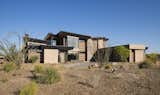Blue skies and desert terrain serve as the perfect backdrop for showcasing this contemporary residence's distinctive composition and color palette.

The Village at Seven Desert Mountain—Scottsdale
Architecture: Drewett Works
Builder: Cullum Homes
Interiors: Ownby Design
Landscape: Greey | Pickett
Photographer: Dino Tonn

https://www.drewettworks.com/the-model-home-at-village-at-seven-desert-mountain/