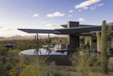 The Crusader's winged roof jets out over a negative-edge pool, framing the stunning mountain and city views beyond. 

Estancia Club
Builder: Peak Ventures
Interiors: Ownby Design
Landscape: High Desert Designs
Photography: Jeff Zaruba