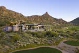 The lot, located in the prestigious Estancia Golf Club community, sits on a peninsula, highly exposed on three sides yet with tremendous views.

Estancia Club
Builder: Peak Ventures
Interiors: Ownby Design
Landscape: High Desert Design
Photography: Jeff Zaruba
