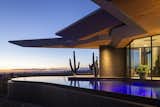 The angled roof lines of the Crusader hover over a negative-edge pool and add even more drama to the incredible sunset beyond.

The builder’s courage to see this project vision through to the end was rewarded with a record price per square foot for Scottsdale, a testament to the fact that buyers find intrinsic value in passionate design.

Estancia Club
Builder: Peak Ventures
Interior Design: Ownby Design
Landscape: High Desert Designs
Photography: Jeff Zaruba