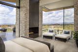 The master suite, with pocketing glass doors, seamlessly connects to outdoor patio space. A custom fireplace offers warmth while the views take your breath away.

Estancia Club
Builder: Peak Ventures
Interior Designer: Ownby Design
Photography: Jeff Zaruba