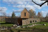 Exterior, Flat RoofLine, Metal Roof Material, Stone Siding Material, Wood Siding Material, House Building Type, Farmhouse Building Type, and Gable RoofLine  Photo 3 of 7 in GRANNYcottage by in.site:architecture