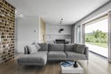 Living Room, Ceiling Lighting, Sofa, Medium Hardwood Floor, and Pendant Lighting  Photos from BLACK BOX HOUSE