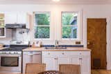 The kitchen includes stainless steel appliances with a pot filler.