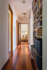 A long hallway lined with bookshelves