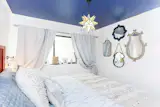 Whimsical bedroom with painted ceiling