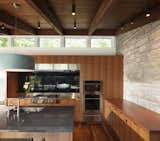 Kitchen, Wall Oven, Cooktops, Engineered Quartz, Wood, Medium Hardwood, Metal, Glass Tile, Ceiling, Pendant, and Undermount  Kitchen Wall Oven Metal Undermount Ceiling Photos from Gleason Lake Mid-Century