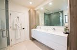 Modern Bathroom with his + her sinks, rainfall shower and built ins
