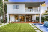 Backyard with Dining Deck, Pool with water feature and Turf
