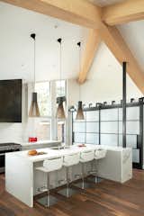 Kitchen, Range, Undermount Sink, Pendant Lighting, and Dark Hardwood Floor  Photo 6 of 17 in Brick House by Kimball Modern