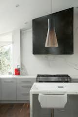 Kitchen, Pendant Lighting, Dark Hardwood Floor, and Range  Photo 8 of 17 in Brick House by Kimball Modern