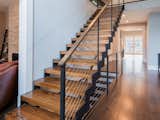 Staircase, Cable Railing, Wood Tread, and Metal Railing  Photo 13 of 17 in stairs 2 by Alex Morozov from Zig Zag Stairs