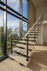 Staircase, Wood Tread, Glass Railing, and Metal Railing Thick White Oak Stair Treads with Glass Railings.  Photo 5 of 6 in Montauk Party House by Keuka Studios