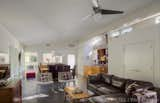 Living Room, Chair, Sofa, Sectional, Ceiling Lighting, and Concrete Floor The living room looks onto the dogtrot.  Photo 11 of 16 in Dogtrot at Stony Point by hays+ewing design studio