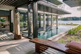 View of pool and canopy.  Pool offers a foreground to the bay beyond.