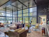 Louvers and trellis shade the south and westerly sun.  In winter, triple pane windows by Optiwin are ten degrees warmer than if double pane.  Below the flight path of naval jets, the windows and heavily insulated walls make the home quiet and extremely energy efficient.  Decor by DaMotta Design.