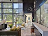 Large sliding glass doors separate the kitchen from dining room when entertaining.  Bypass doors are custom laminated with artwork by Eros Zhao.  Interiors by DaMotta Design.