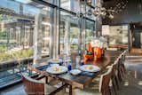 Dining room light: Branching Burst by Lindsey Adelman.  Dining room looks onto the pool.  Interiors by DaMotto Design.