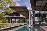 A central trellis extend from the entry, through the house to hover above the pool, thereby extending the view through to the bay.