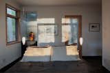 Bedroom, Bed, Pendant Lighting, and Medium Hardwood Floor  Photo 15 of 16 in Stony Point House by hays+ewing design studio