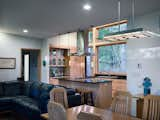 Dining Room, Chair, Pendant Lighting, Table, and Medium Hardwood Floor  Photo 13 of 16 in Stony Point House by hays+ewing design studio