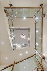 Pendant Lighting, Staircase, Wood Railing, Wood Tread, and Glass Railing  Photo 13 of 14 in The Wilds by KA DesignWorks