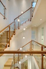 Glass Railing, Living Room, Wood Tread, Wood Railing, and Pendant Lighting  Photo 8 of 14 in The Wilds by KA DesignWorks