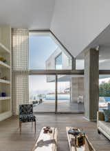 Living Room, Chair, Coffee Tables, and Medium Hardwood Floor  Photo 10 of 19 in Lavasan Villa by Hariri & Hariri Architecture