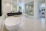 Bath Room, Ceiling Lighting, Freestanding Tub, and Enclosed Shower  Photo 9 of 19 in Linea Residence by Zillow
