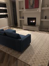 Living Room, Sofa, Ceramic Tile Floor, Recessed Lighting, Standard Layout Fireplace, Gas Burning Fireplace, and Ceiling Lighting  Photo 5 of 10 in The Cooke North Valley House by Daniel Cooke