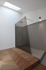 Bath Room, Light Hardwood Floor, Two Piece Toilet, Open Shower, and Wall Lighting  Photos from cdr