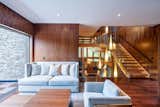 Living Room, Medium Hardwood Floor, Pendant Lighting, and Sofa  Photo 4 of 7 in Brecksville Residence by Dimit Architects