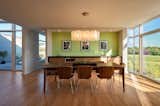 Dining Room, Pendant Lighting, Medium Hardwood Floor, Table, and Chair  Photo 7 of 10 in Bainbridge Residence by Dimit Architects