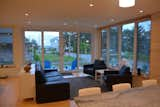 Recessed Lighting, Light Hardwood Floor, Kitchen, Chair, Console Tables, Sofa, and Engineered Quartz Counter Living/Dining/Kitchen looking toward the beach  Photo 3 of 7 in Eiderdown by David Johnson