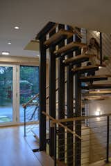 Staircase, Wood Tread, Metal Tread, Metal Railing, and Wood Railing Stair looking toward main entry  Photo 6 of 7 in Eiderdown by David Johnson