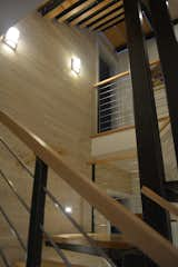 Staircase, Metal Tread, Wood Tread, Wood Railing, and Metal Railing Stair looking up between levels and landings  Photo 7 of 7 in Eiderdown by David Johnson