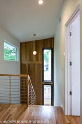 Staircase, Wood Tread, Wood Railing, and Metal Railing Stainless steel stair and White Oak accent wall  Photos from Tree House