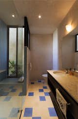 Bath Room, Granite Counter, Ceramic Tile Floor, Drop In Sink, Enclosed Shower, Concrete Wall, Ceiling Lighting, and Stone Tile Wall  Photo 6 of 10 in Casa RC80 by Taller Estilo Arquitectura