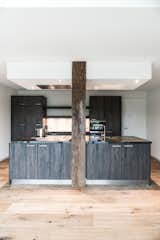 Kitchen, Light Hardwood Floor, Granite Counter, and Wood Cabinet Kitchen, rural modern  Photo 6 of 20 in Dutch Farmhouse by Diana Lautenbag
