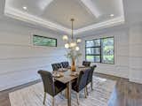 The dining room with modern wainscotting with tray ceiling with LED uplighting  Photo 4 of 21 in Contemporary Craftsman Home by Timothy McCollum