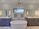 Bath Room, Undermount Sink, Marble Floor, Freestanding Tub, Soaking Tub, Recessed Lighting, Engineered Quartz Counter, and Accent Lighting Master bathroom with marble herringbone floor  Photo 15 of 21 in Contemporary Craftsman Home by Timothy McCollum